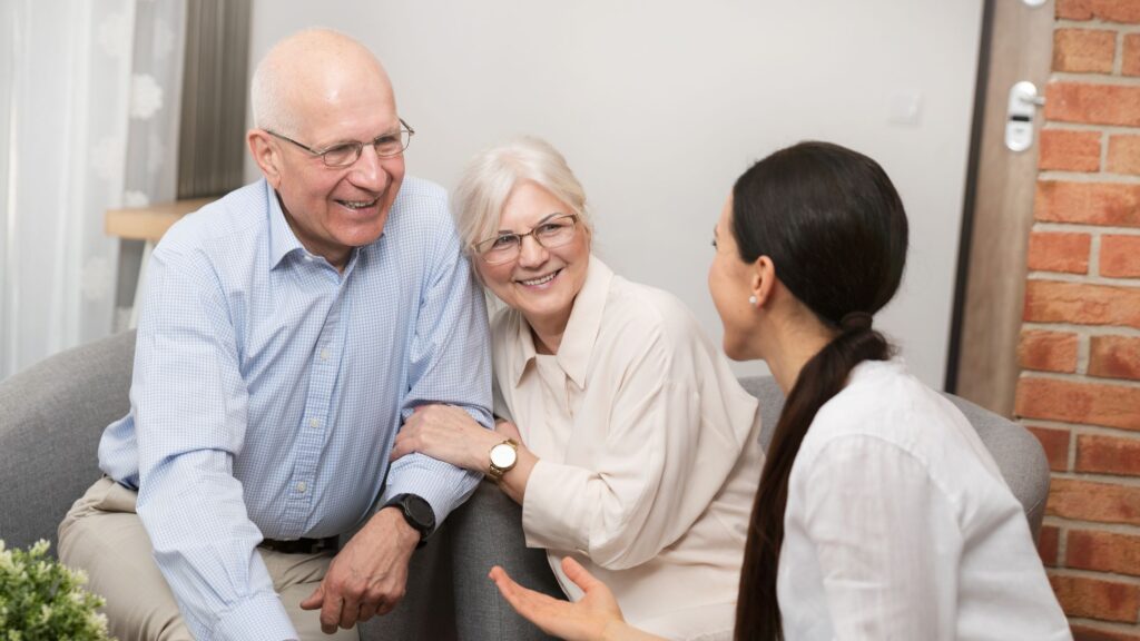 An attorney speaking with two elderly people